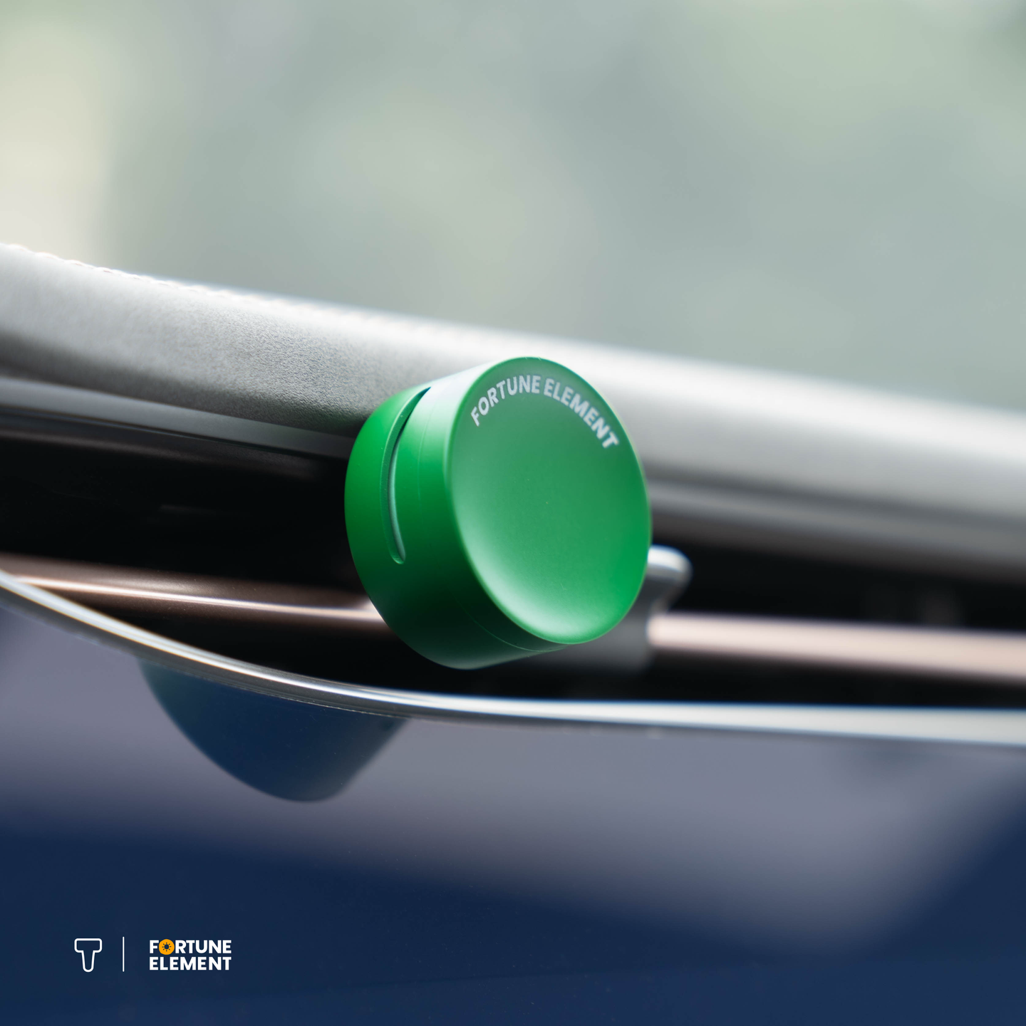 A close-up shot of the fortune element car diffuser clipped into the car's vent, highlighting its secure attachment and integration with the vent design